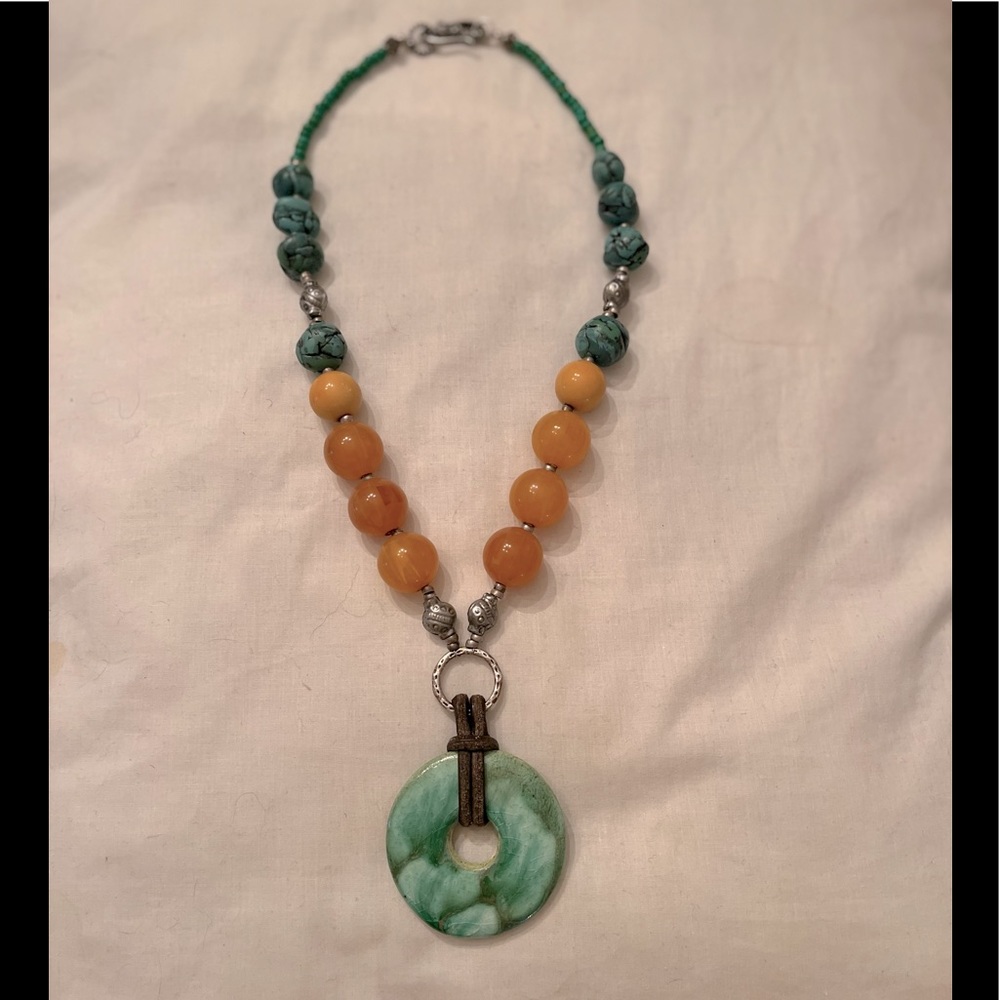 Necklace with jade like pendant, leather, amber beads, turquoise like beads
